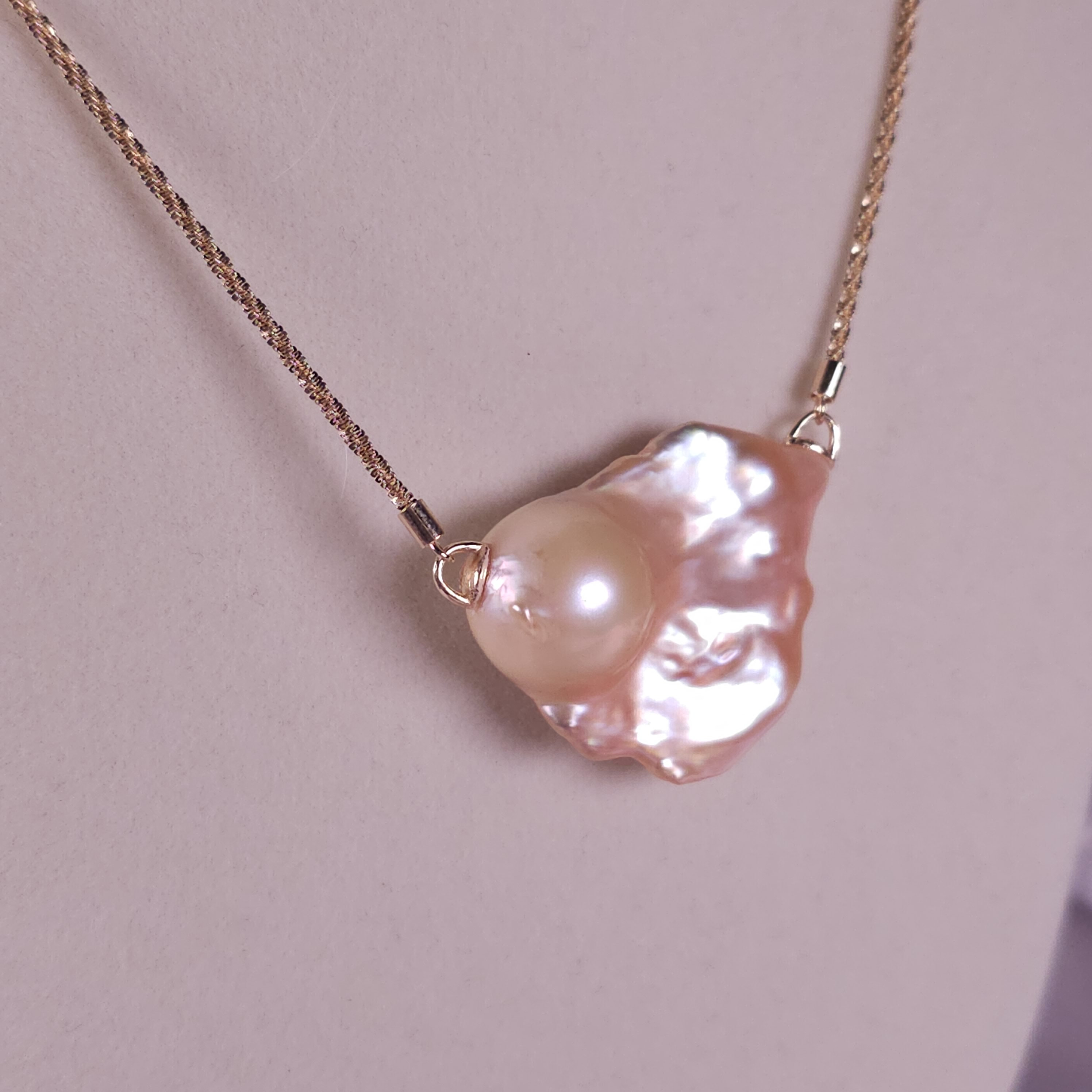 Genuine baroque natural freshwater pearl on a gold plated, silver chain!