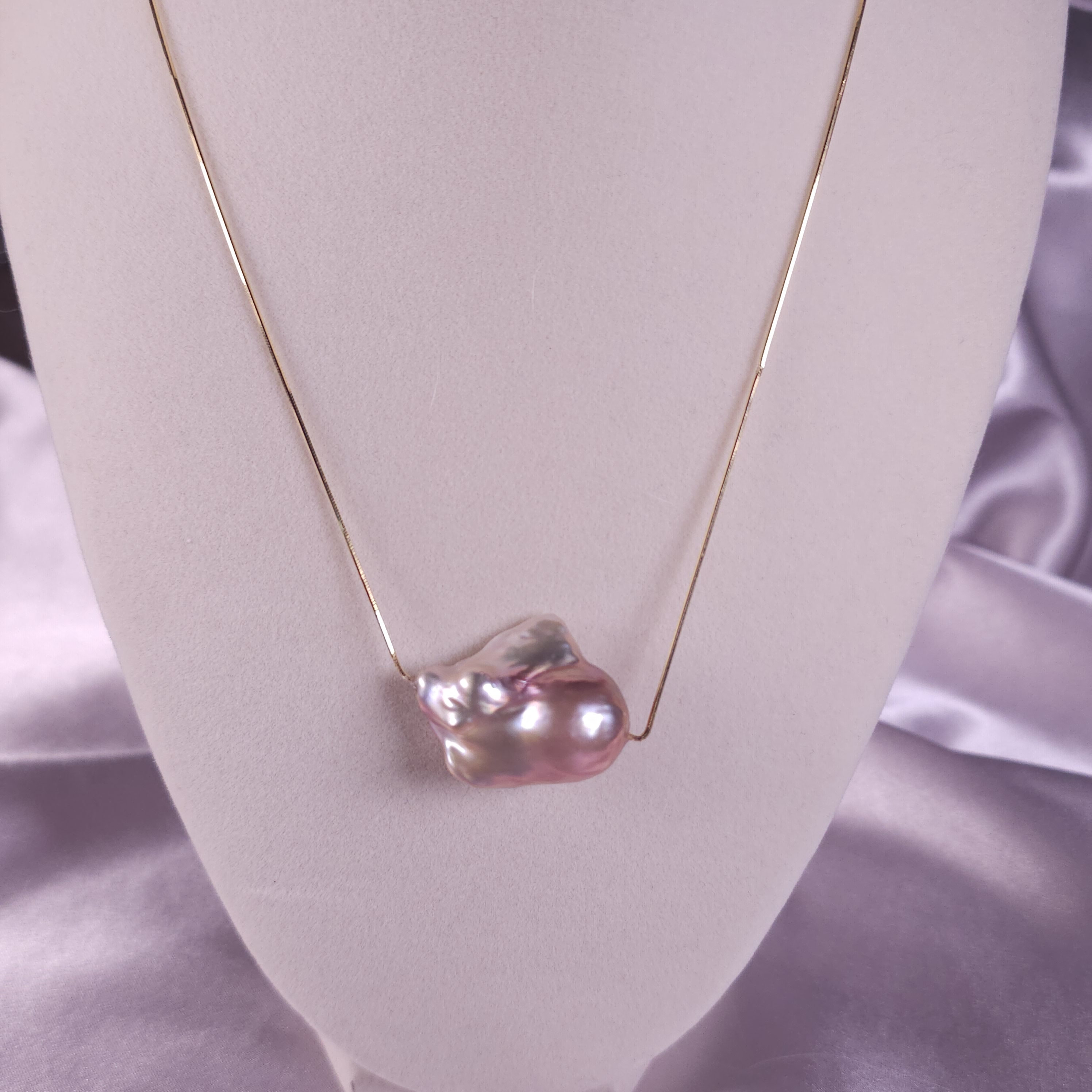 Genuine baroque natural freshwater pearl on a gold plated, silver snake chain (18")